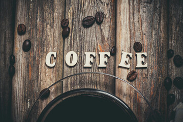 Black coffee in a glass mug on a vintage background, aromatic coffee for energy