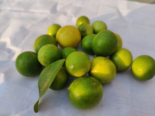 Lemons are on the ground with the background