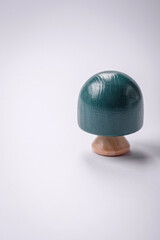 Wooden model of a tree with a green crown and trunk on a white background