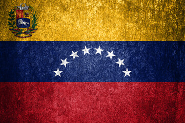 Close-up of the grunge Venezuela flag. Dirty flag of Venezuela on a metal surface.
