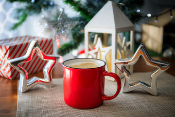 Red mug with hot cappuccino coffee