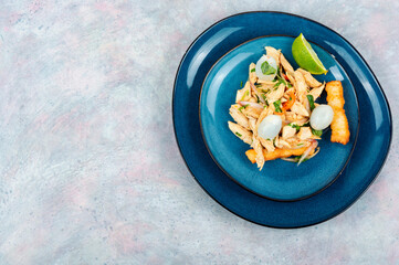 Fresh salad with chicken, lychee and lime.