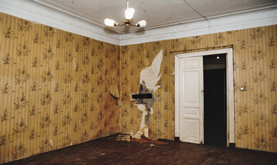 Living room aged interior of an abandoned communal apartment, tripped wallpaper, cuffed floor....