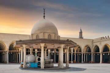 Tanquil courtyard of the Mosque of Amr ibn al-A'as, Egypt's oldest mosque, with sun-drenched dome...