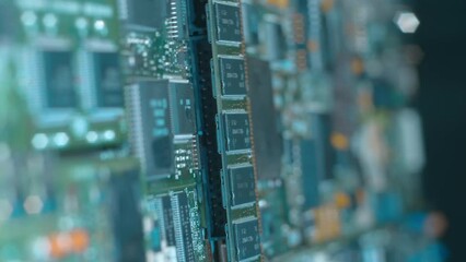 Electronic boards with many different microcircuits and other radio components show the complexity of the products of the modern electronics industry. Closeup. Macro. Shallow depth of field. Shot in m