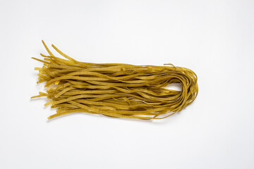 Raw pasta on white background