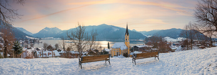dreamy winter sunset scenery at Weinberg hill, tourist resort Schliersee with alps and lake view