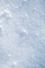 white texture of snow on a snowdrift on a cold winter day
