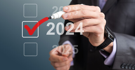 Businessman pressing virtual button New 2024 Year