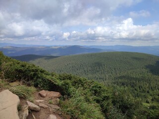 A view of the mountains from a height in the warm season