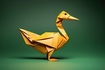 Orange paper origami duck isolated on dark green background. Folded paper sculpture - obrazy, fototapety, plakaty