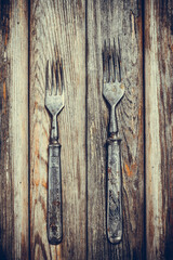 Vintage fork on wooden background