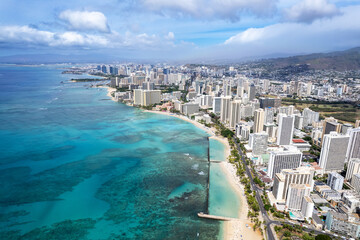 Drone view of man made Waikiki Beach in Honolulu, HI, showing it's wall wave barrier