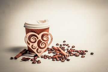 Coffee beans in a paper cup