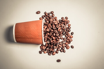 Coffee beans in a paper cup