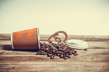 Coffee beans in a paper cup