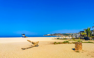 Sun beach sand surfer waves palms in Puerto Escondido Mexico.