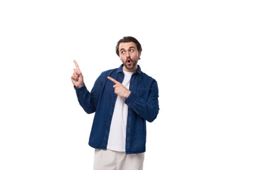 portrait of a young european brutal brunette man with a cool hairstyle pointing his index finger