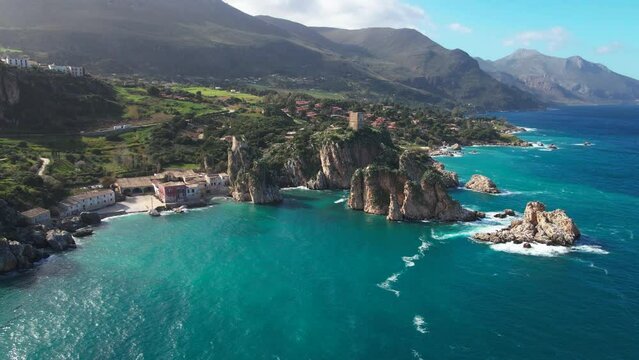 Late afternoon aerial footage of Faraglioni di Scopello in Sicily, Italy