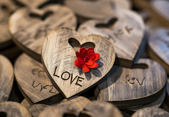 wooden heart with a red flower