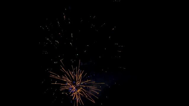 Fireworks at Night,Stars of the fireworks are on a dark blue background,Colorful firework with bokeh background. New Year celebration, Abstract holiday background