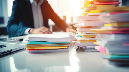 Focused Professional Analyzing Stacks of Documents