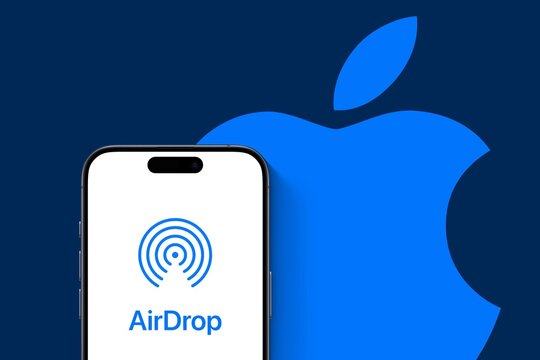 AirDrop as a proprietary wireless ad hoc service in Apple Inc.'s iOS, macOS, and visionOS operating systems for transferring files among devices by means of close-range wireless communication