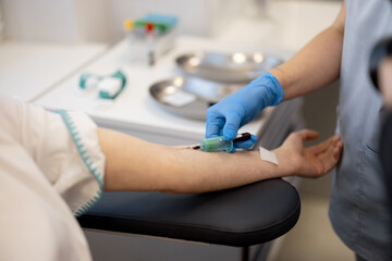 Process of taking venous blood into a test tube in laboratory, close-up