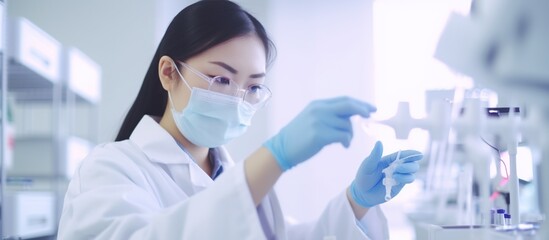 Portrait of beautiful scientist doing analysis in laboratory