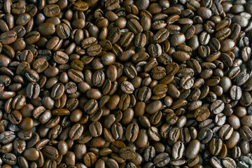 Close Up Of Coffee Beans Background. Fresh roasted coffee beans texture.