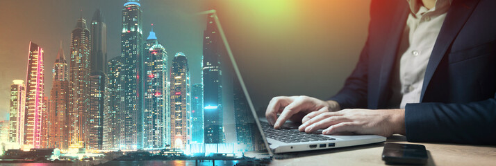 business man sitting in front of laptop working