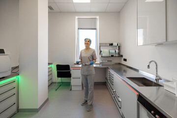 Medical worker works in the sterilization room of the operating room