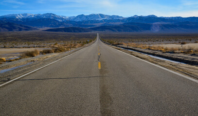 Straight Road in the California desert, going into the mountains near Death Valley National Park