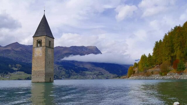 Time lapse video - Curon bell tower emerges from Lake Resia - South Tyrol (Italy)