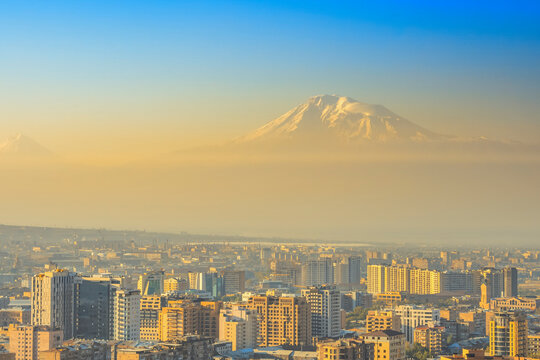Sunset over the Yerevan city with Ararat mountains at background