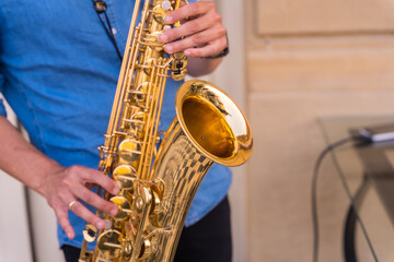 Detail of hands of jazz musician playing saxophone, Jazz mood Concept