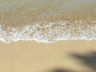 Fototapeta na wymiar waves on the sand 