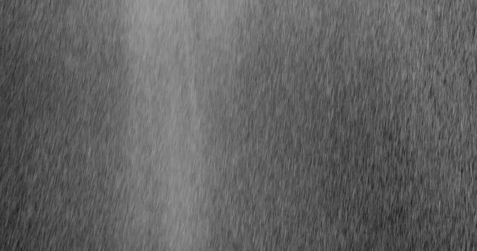 Rain Medium 6 3730 2K Diagonal heavy rain falling in front of the camera against black screen. Raindrops splashing. Rain closeup vfx insert. Practical seamlessly loopable footage. Heavy rainstorm hitt