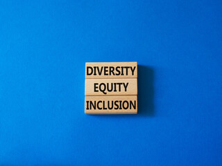 Diversity Equity Inclusion symbol. Concept words Diversity Equity Inclusion on wooden blocks. Beautiful blue background. Business and Diversity Equity Inclusion concept. Copy space