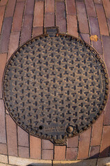 Cast iron manhole cover on a paved street