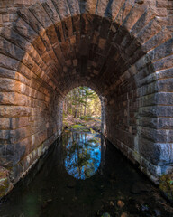 Looking through a tunnel water reflection