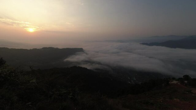 Timelapse sunrise high altitude over clouds dynamics in the morning over Pokhara Nepal lake
