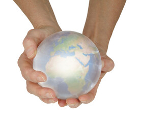 Predicting Global events via crystal Ball reading - female hands holding a crystal ball containing Planet Earth isolated against white background
