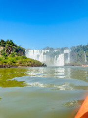 Obraz premium Iguazu Falls, Argentina. Iguazu Falls is the largest series of waterfalls in the world. Getting to know the beautiful waterfalls surrounded by nature on warm spring summer days
