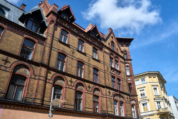 historic red brick tenement house in the city of Poznan