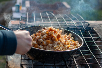 Cooking the typical Spanish dish of 