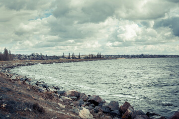 River bank in windy weather with waves