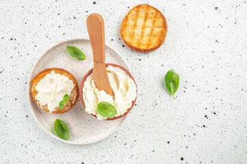 bread with cream cheese on a light background. Detox and clean diet concept. place for text, top view - obrazy, fototapety, plakaty