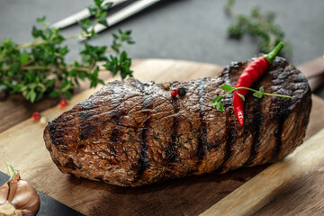 Beef Steak medium rare on a wooden board, top view. copy space
