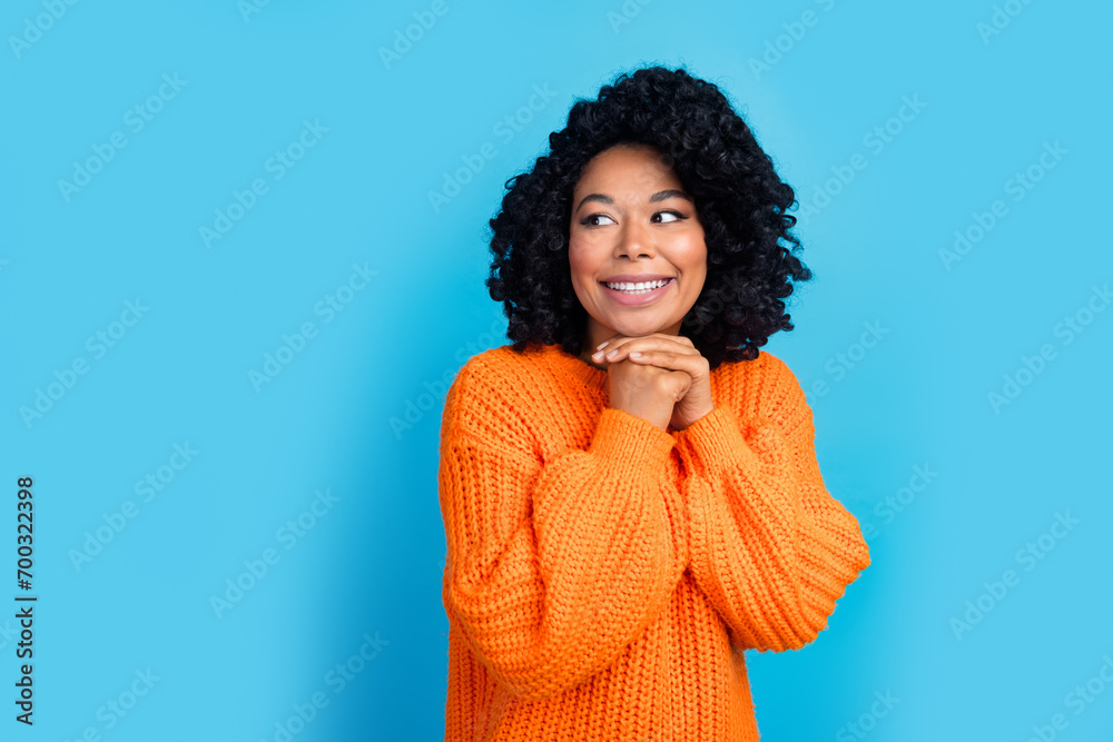 Wall mural photo portrait of lovely young lady look empty space admire wear trendy knitwear orange garment isol